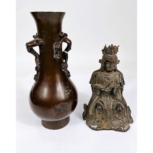 451 - A Chinese bronze of a seated buddha holding a mirror, height 16.5cm and a bronze vase