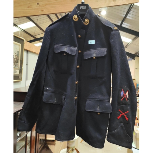 263 - A Royal Marine's dress coat with collar badges, shoulder badges and sleeve patches