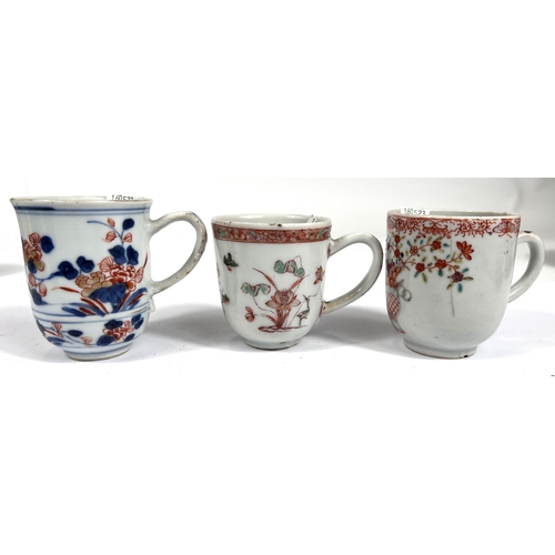 357C - Three Chinese tea cups with decoration of flowers etc, ht 7cm, 6.5cm, and 6cm