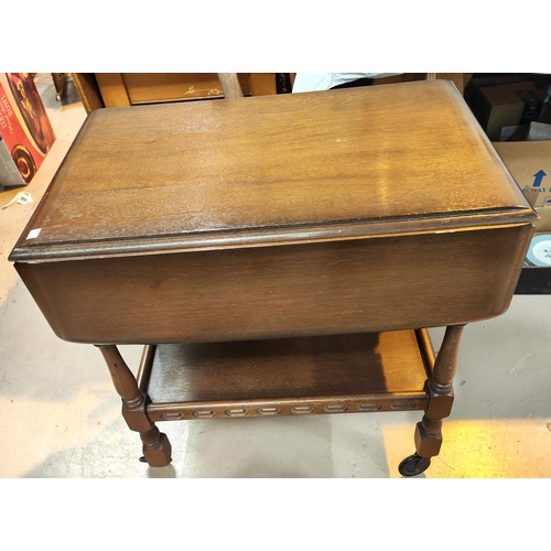 841 - An oak period style drop leaf tea trolley of 2 tiers