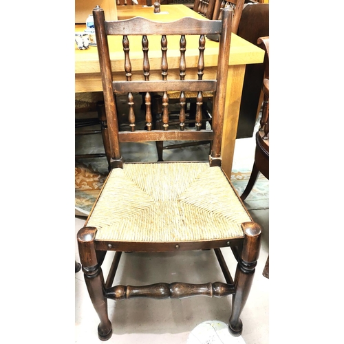 857 - A set of 6 Lancashire spindle back dining chairs with rush seats