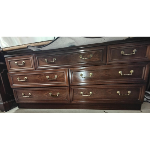 877 - A Gplan mahogany effectbedroom suite comprising 2 double wardrobes, 7 drawer chest and 5 drawer ches... 