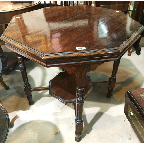 891 - An Edwardian mahogany octagonal table with turned legs