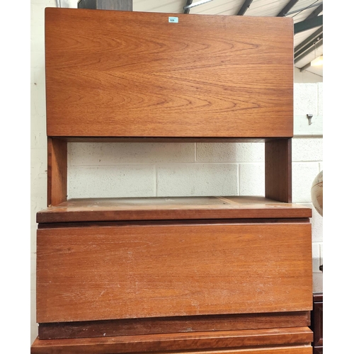 926 - A mid 20th century teak designer wall unit with fall front unit above and bellow with the base being... 