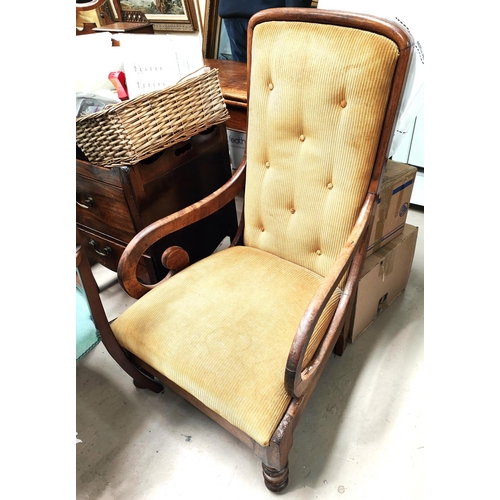 976 - A Victorian mahogany scroll arm chair in gold fabric