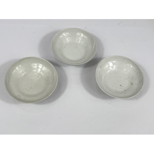 357F - Three matching Chinese ceramic short pedestal dishes with polychrome decoration to underside and pol... 