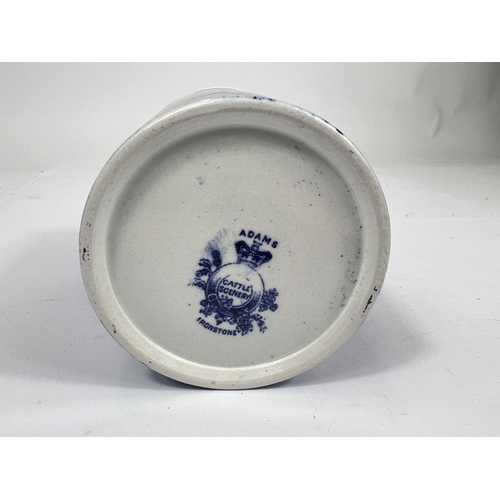 582 - A 19th century Adame blue and white mug decorated with cattle grazing (underglaze chip to rim)