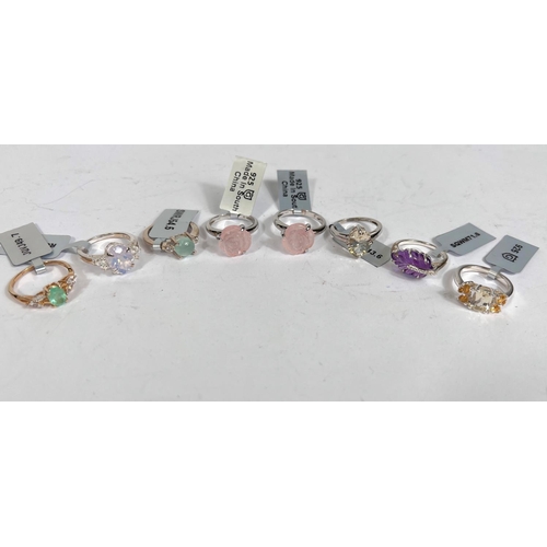 721 - 8 silver rings, various designs and coloured stones