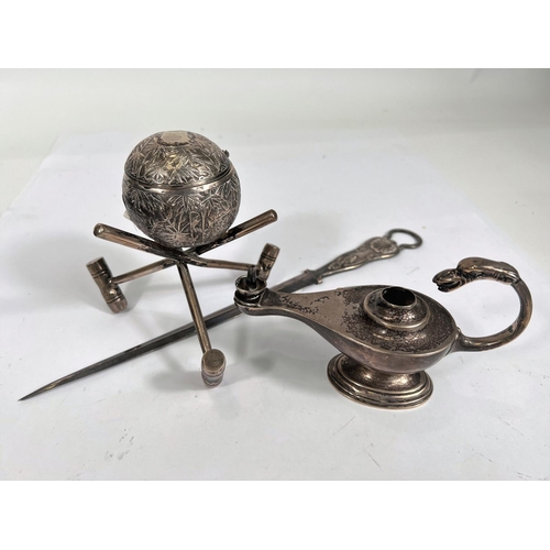 736 - A table lighter in the form of Aladdin's lamp, Birmingham 1912, 3oz; a white metal croquet trophy in... 