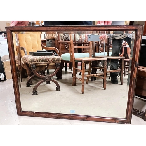 869 - An Edwardian wall mirror in rosewood frame with rectangular bevelled glass plate, 70 x 91cm overall