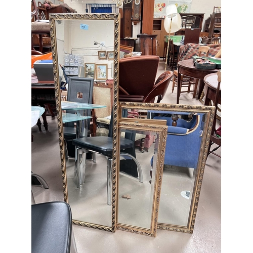 903 - Three gilt framed mirrors of various sizes and another wooden framed mirror