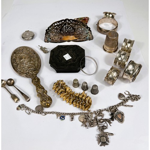 727 - A selection of silver; silver plate and costume jewellery:  napkin rings; charm bracelet; a cha... 