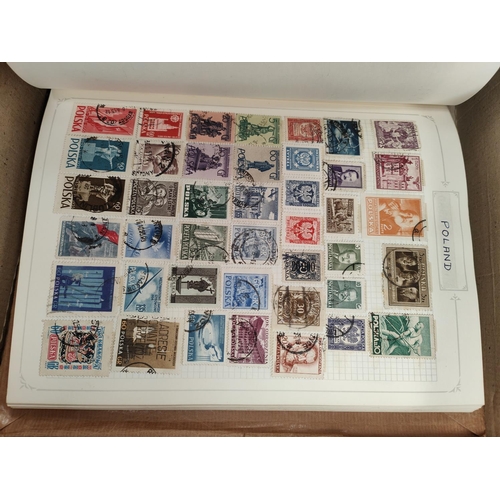 318A - A collection of World stamps in three spring back albums