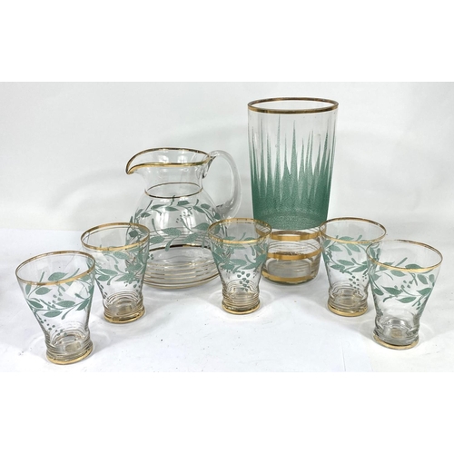 598 - A vintage lemonade set of 5 glasses and jug with gilt and green lesf decoration; a similar vase and ... 