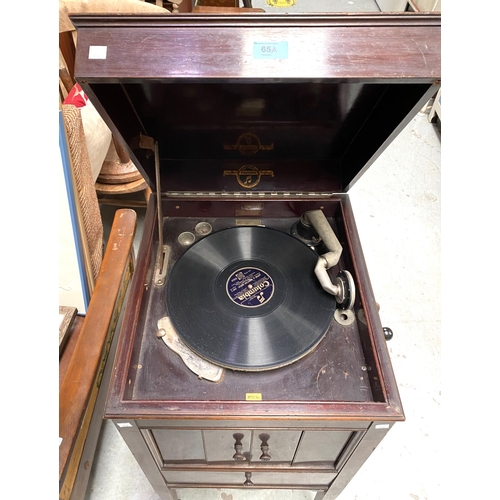 65A - A wind-up gramophone in mahogany case, Columbia floor standing model 124a