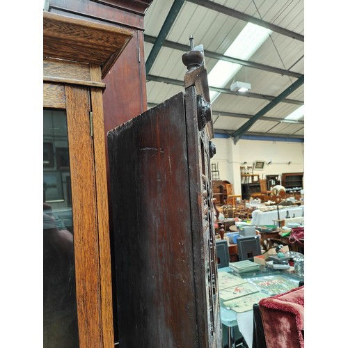 842 - A Middle Eastern full height corner cupboard with extensive carved and inlaid decoration, open shelv... 