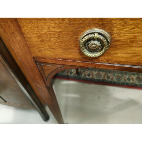 853 - An Arts & Crafts period kneehole mahogany dressing table with 2 drawers and 2 jewellery drawers ... 