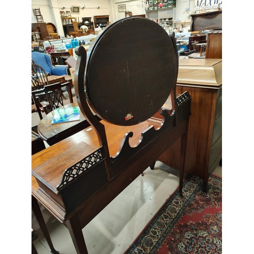 853 - An Arts & Crafts period kneehole mahogany dressing table with 2 drawers and 2 jewellery drawers ... 