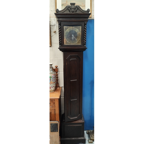 1000A - An oak cased 1930's brass dial granddaughter clock, glass door detached but present 