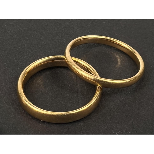 603 - 2 x 22ct hallmarked gold wedding bands, 7.3gms.