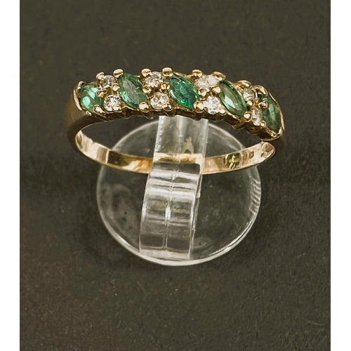 648 - A gold dress ring, hallmarks worn, set with 5 emerald coloured stones and smaller diamonds around, s... 