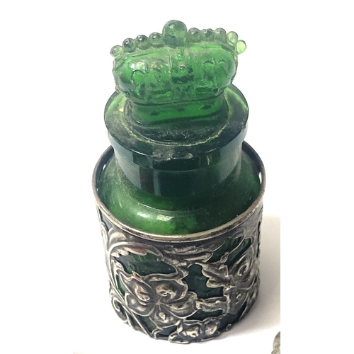 652 - A green glass bottle with crown shaped stopper with hallmarked silver surround; a Cranberry glass sc... 