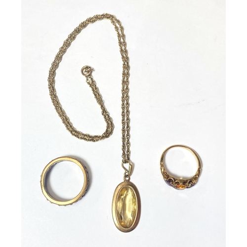 673 - A modern 9ct gold pendant set oval citrine, the chain marked 375, a dress ring set with 3 stones and... 