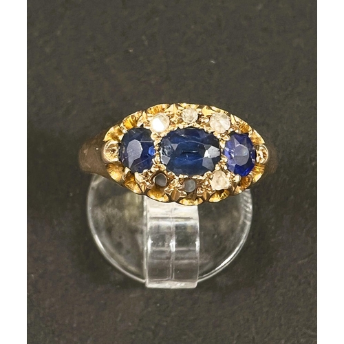 683 - An 18 carat hallmarked gold dress ring with 3 sapphires and diamond chips in split shank settin... 