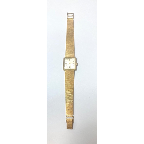 685 - A lady's Zenith wristwatch in 9 carat hallmarked gold case and integral strap, net weight 25gm