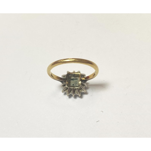 686 - An 18 carat hallmarked gold dress ring set square cushion cut emerald surrounded by 14 diamonds... 