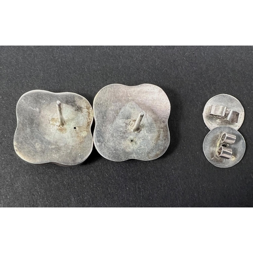 687 - A pair of white metal pierced earrings in the Georg Jensen style 89, but unmarked.... 