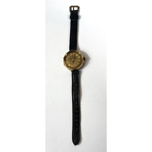 699 - An early 20th century traditional wristwatch with 14k mark to case, etched dial, Roman numerals, dia... 