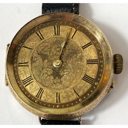 699 - An early 20th century traditional wristwatch with 14k mark to case, etched dial, Roman numerals, dia... 