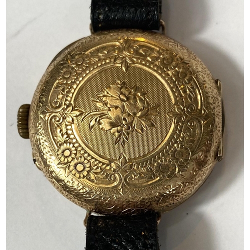 699 - An early 20th century traditional wristwatch with 14k mark to case, etched dial, Roman numerals, dia... 