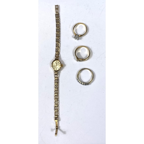 704A - A 9ct gold ladies wristwatch, case and strap gross 8.4gm and three costume rings