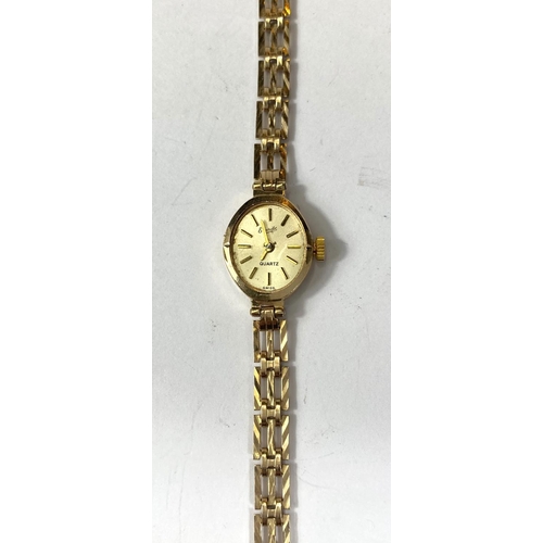 704A - A 9ct gold ladies wristwatch, case and strap gross 8.4gm and three costume rings