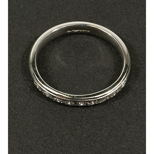 716 - A hallmarked platinum 1/2 eternity ring set with 9 diamonds, 5gm, size N-O