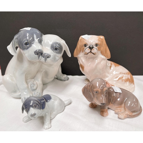 583B - 4 Royal Copenhagen figures of dogs including King Charles Spaniel and a dachshund