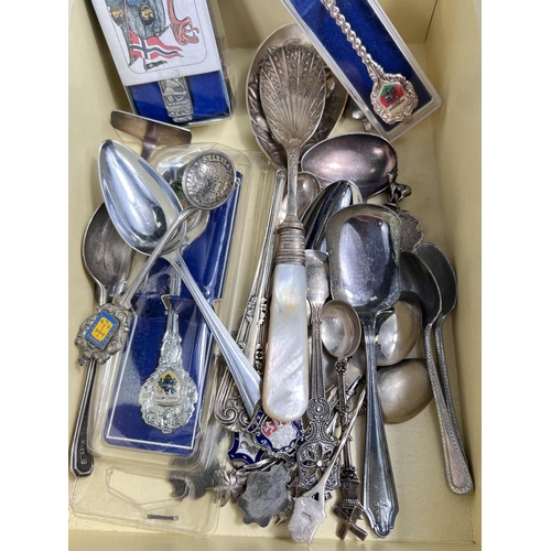 657E - 8 hallmarked silver souvenir spoons, 3oz and other spoons.