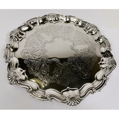 663 - A hallmarked silver Georgian style salver with wavy shell border on 3 ball and claw feet, Sheffield ... 