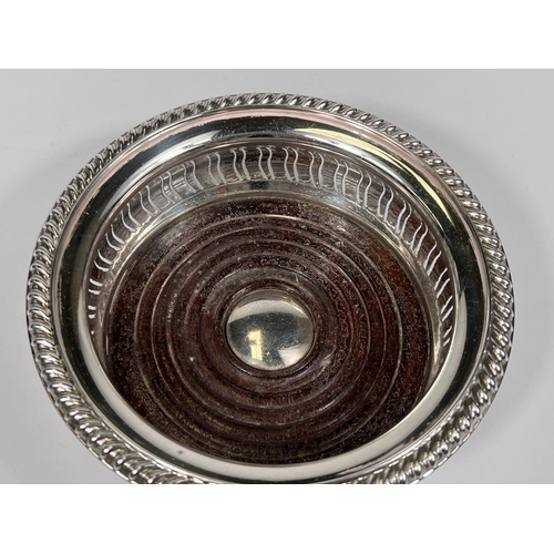 664 - A hallmarked silver coaster, Birmingham 1970, diameter 15cm