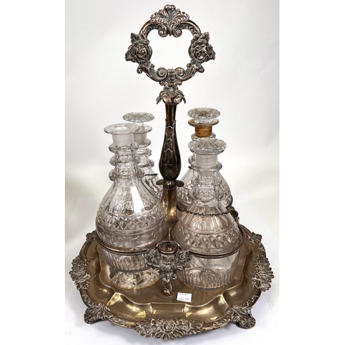 657B - A 19th century 4 division hallmarked silver decanter stand with central handle, relief border and ca... 