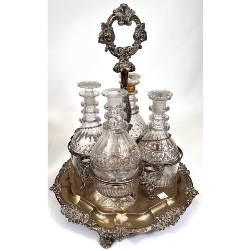 657B - A 19th century 4 division hallmarked silver decanter stand with central handle, relief border and ca... 