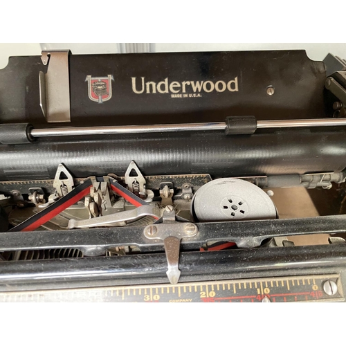 4 - A large Japanned metal typewriter by Underwood