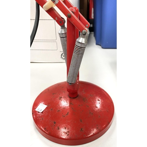 16A - A vintage red angle poise desk lamp.