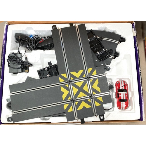 74 - SCALEXTRIC : 4 boxes, each with 2 cars