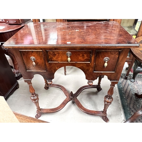 988 - An early Georgian style burr yew lowboy with 3 drawers, shaped apron, turned legs and X stretchers w... 