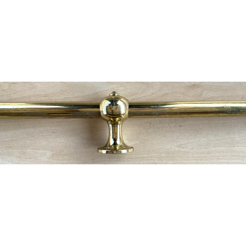 69 - BRASS CURTAIN RAIL, 260cm and another with wall fixings, (terminals a.f) 200cm