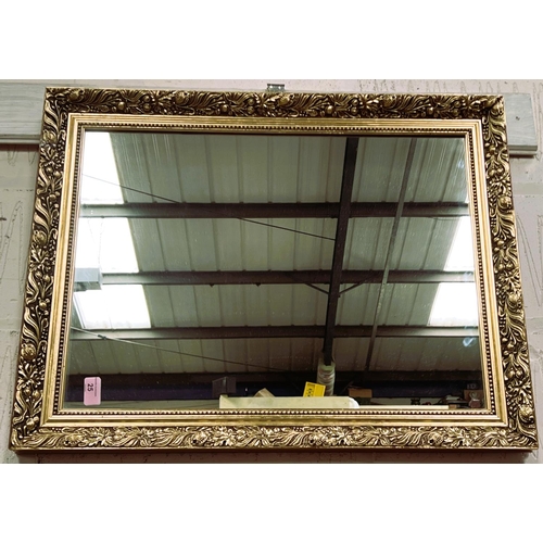 25 - A wall mirror in rectangular gilt frame; a picture of a Swazi warrior; 2 other pictures
