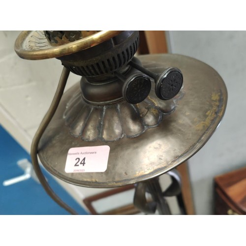 24 - An Art Nouveau standard oil lamp in brass (converted); a table lamp